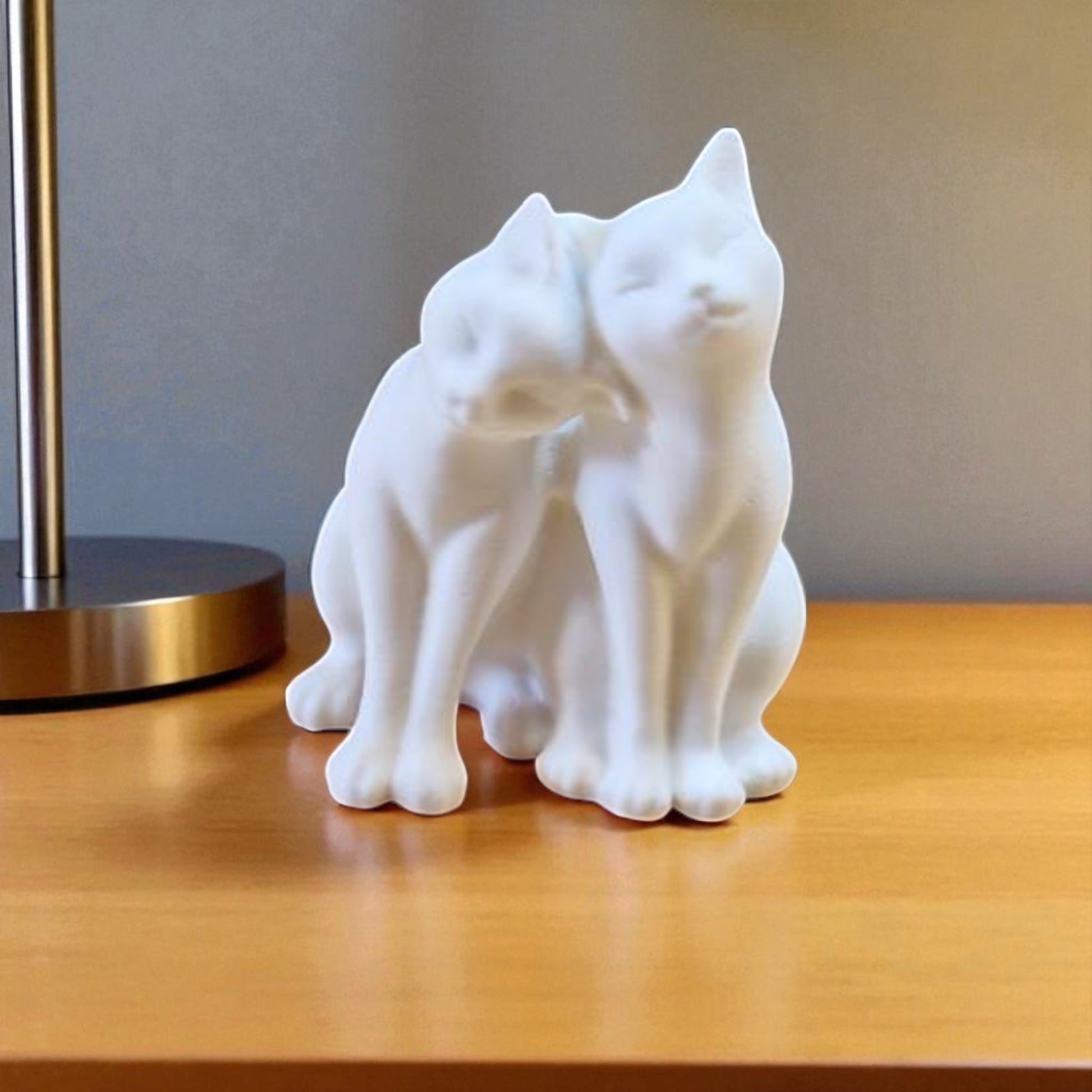 A heartwarming statue of two cats, symbolizing love and companionship between animals. Perfect for cat lovers and a charming addition to any home decor.