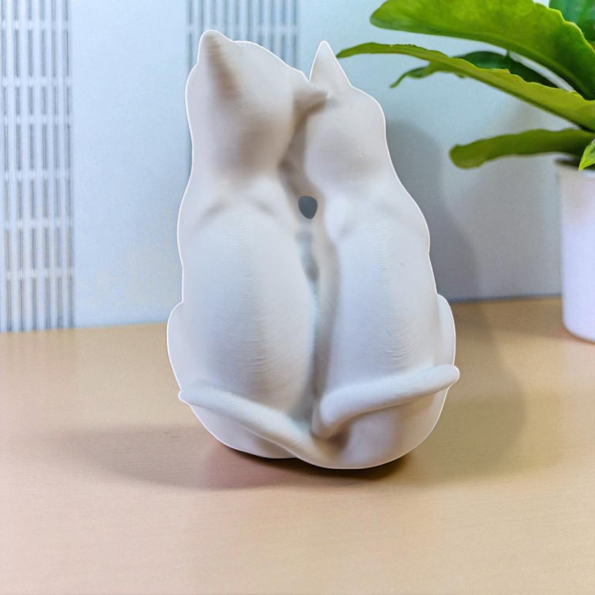 A heartwarming statue of two cats, symbolizing love and companionship between animals. Perfect for cat lovers and a charming addition to any home decor.
