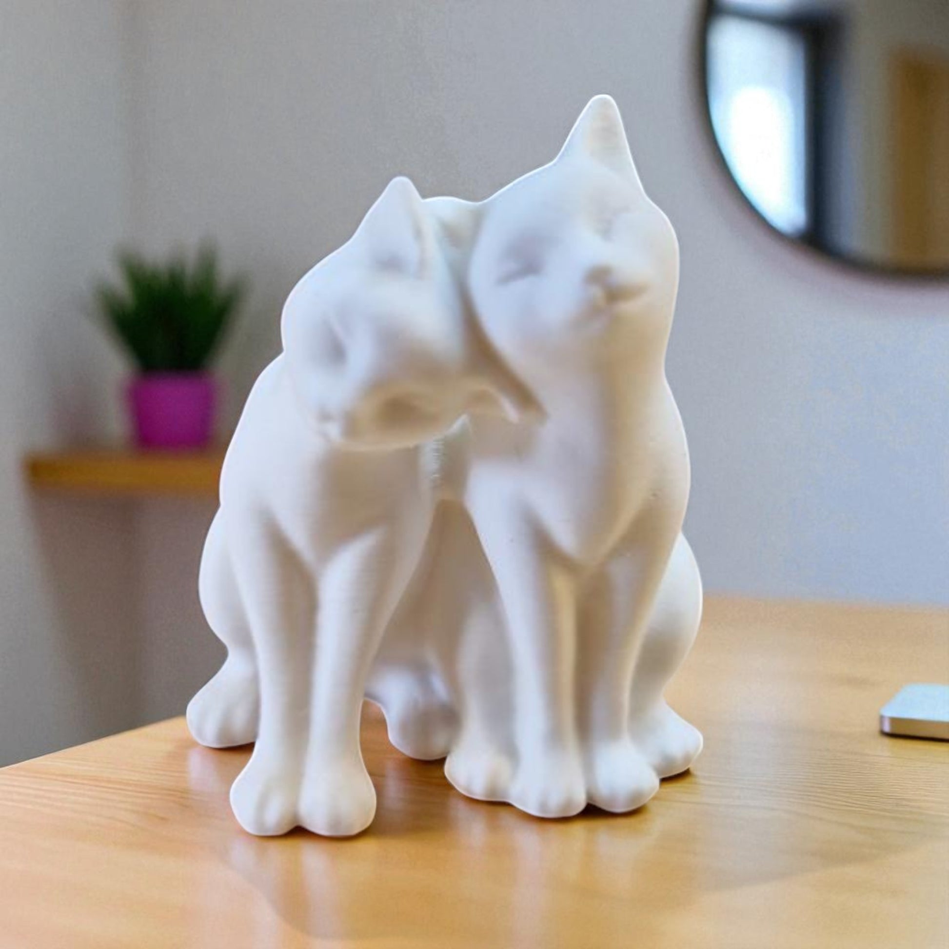 A heartwarming statue of two cats, symbolizing love and companionship between animals. Perfect for cat lovers and a charming addition to any home decor.