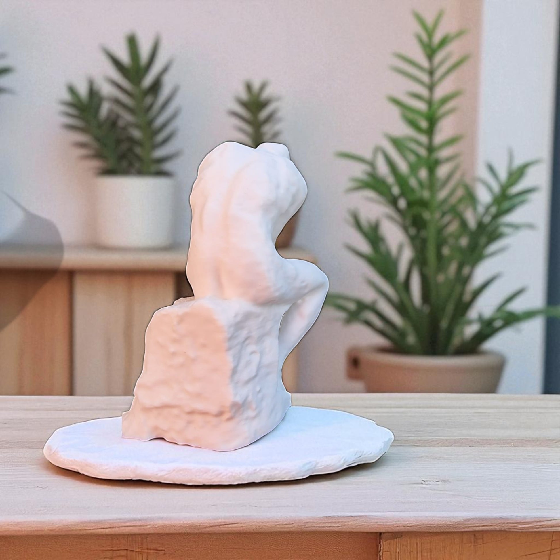 A statue titled 'Contemplative Reflection' depicting a man seated in a thoughtful, meditative pose. This sculpture embodies the essence of mindfulness, yoga, and inner peace, symbolizing the journey of reflection and self-discovery