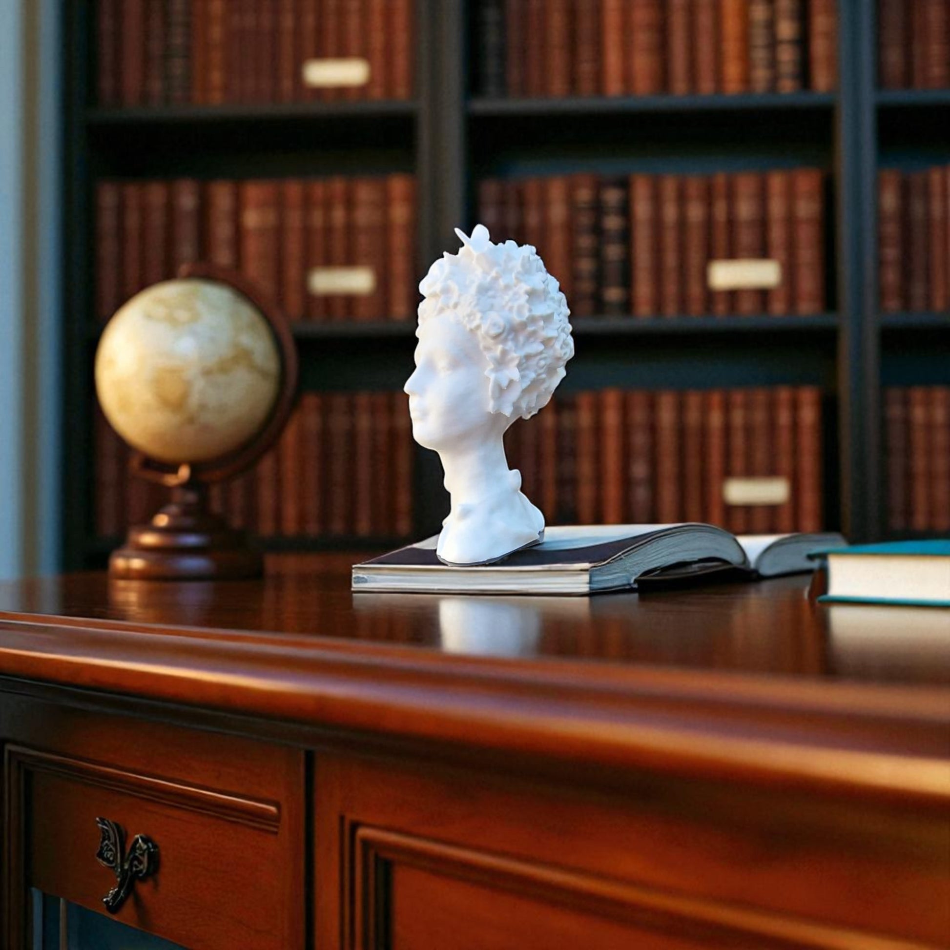 Stunning 'Flora Grace Sculpture,' a statue of an Egyptian-inspired lady resembling Aphrodite, adorned with intricate flowers and butterflies in her hair. This elegant piece exudes beauty and sophistication, making it a timeless decorative accent.