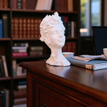 Stunning 'Flora Grace Sculpture,' a statue of an Egyptian-inspired lady resembling Aphrodite, adorned with intricate flowers and butterflies in her hair. This elegant piece exudes beauty and sophistication, making it a timeless decorative accent.