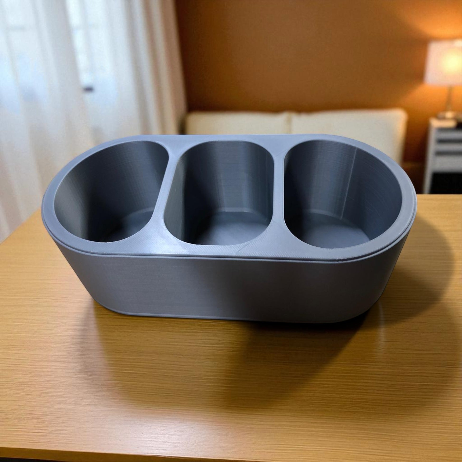 Round Remote Holder a sleek remote holder with three compartments, perfect for organizing remotes, small accessories, or gadgets while adding a modern touch to your living space