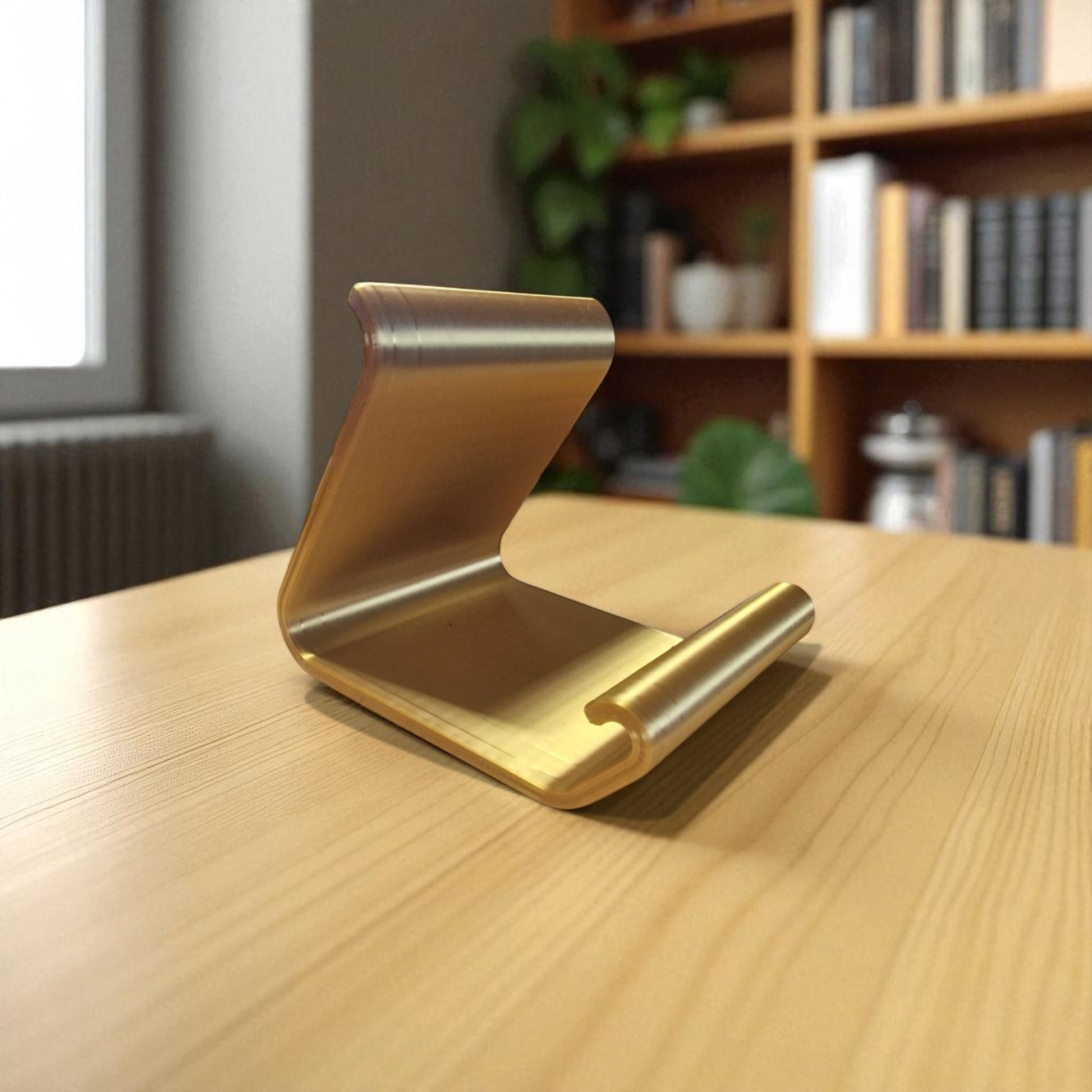 Ergonomic phone holder made of durable 3D-printed material, designed with a sleek and modern look. It securely holds your phone at an optimal angle for comfortable viewing, making it perfect for desks, nightstands, or kitchen counters. Compact, stylish, and practical for everyday use