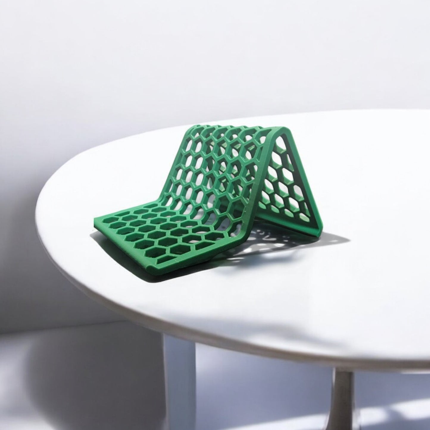 honeycomb stand: a versatile and stylish stand with a honeycomb pattern, designed to hold phones, tablets, and kindles securely at an optimal viewing angle, blending functionality with modern design.