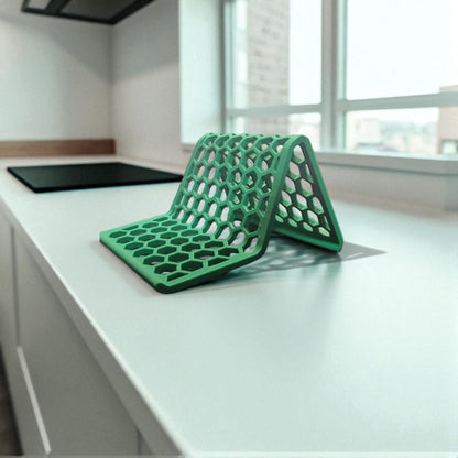 Honeycomb Stand: A versatile and stylish stand with a honeycomb pattern, designed to hold phones, tablets, and Kindles securely at an optimal viewing angle, blending functionality with modern design.