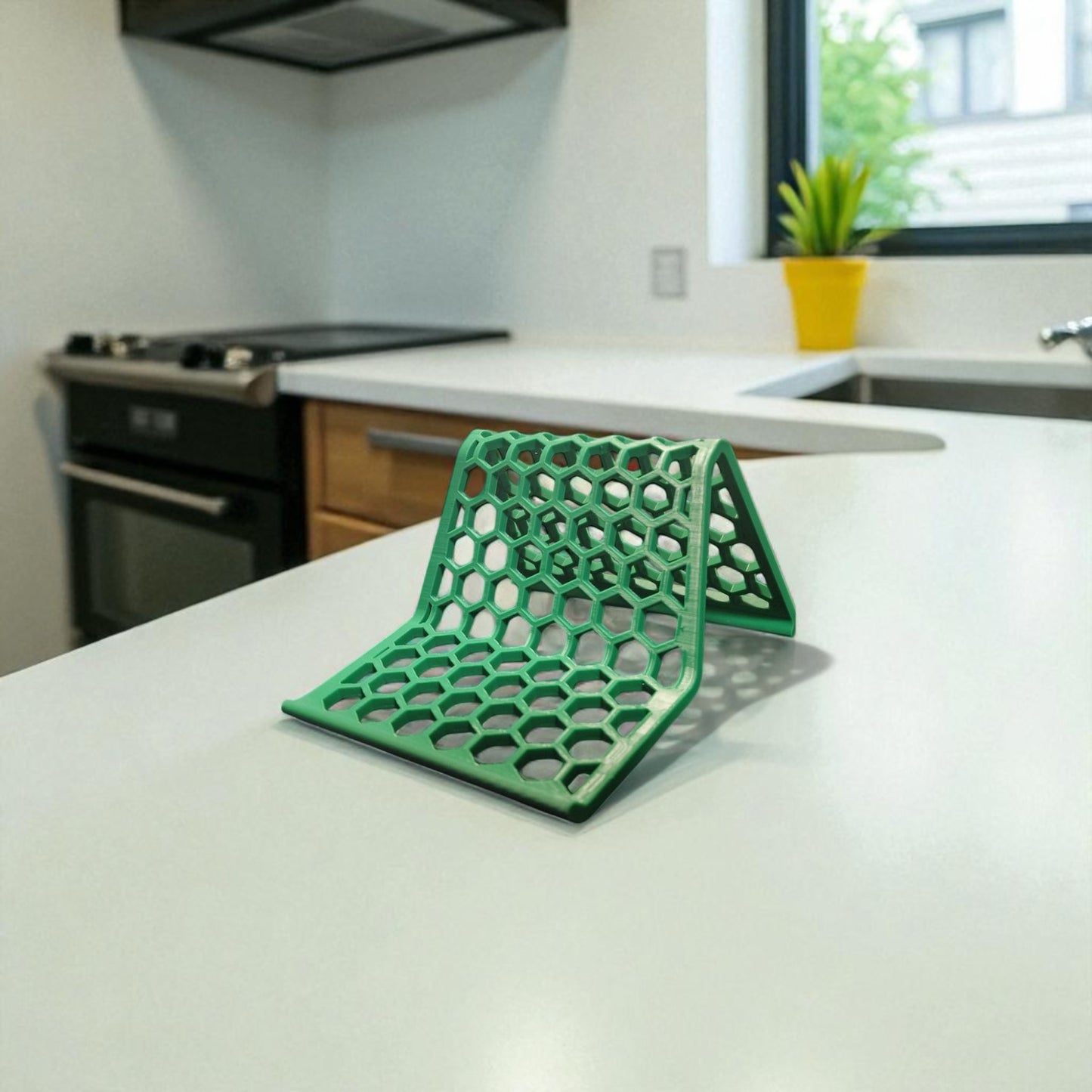 honeycomb stand: a versatile and stylish stand with a honeycomb pattern, designed to hold phones, tablets, and kindles securely at an optimal viewing angle, blending functionality with modern design.