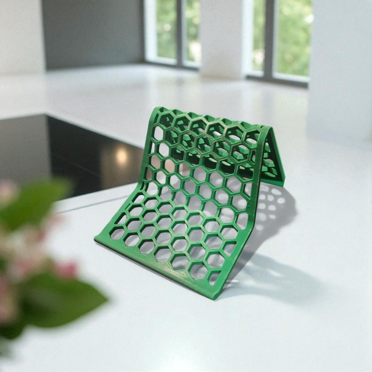 honeycomb stand: a versatile and stylish stand with a honeycomb pattern, designed to hold phones, tablets, and kindles securely at an optimal viewing angle, blending functionality with modern design.