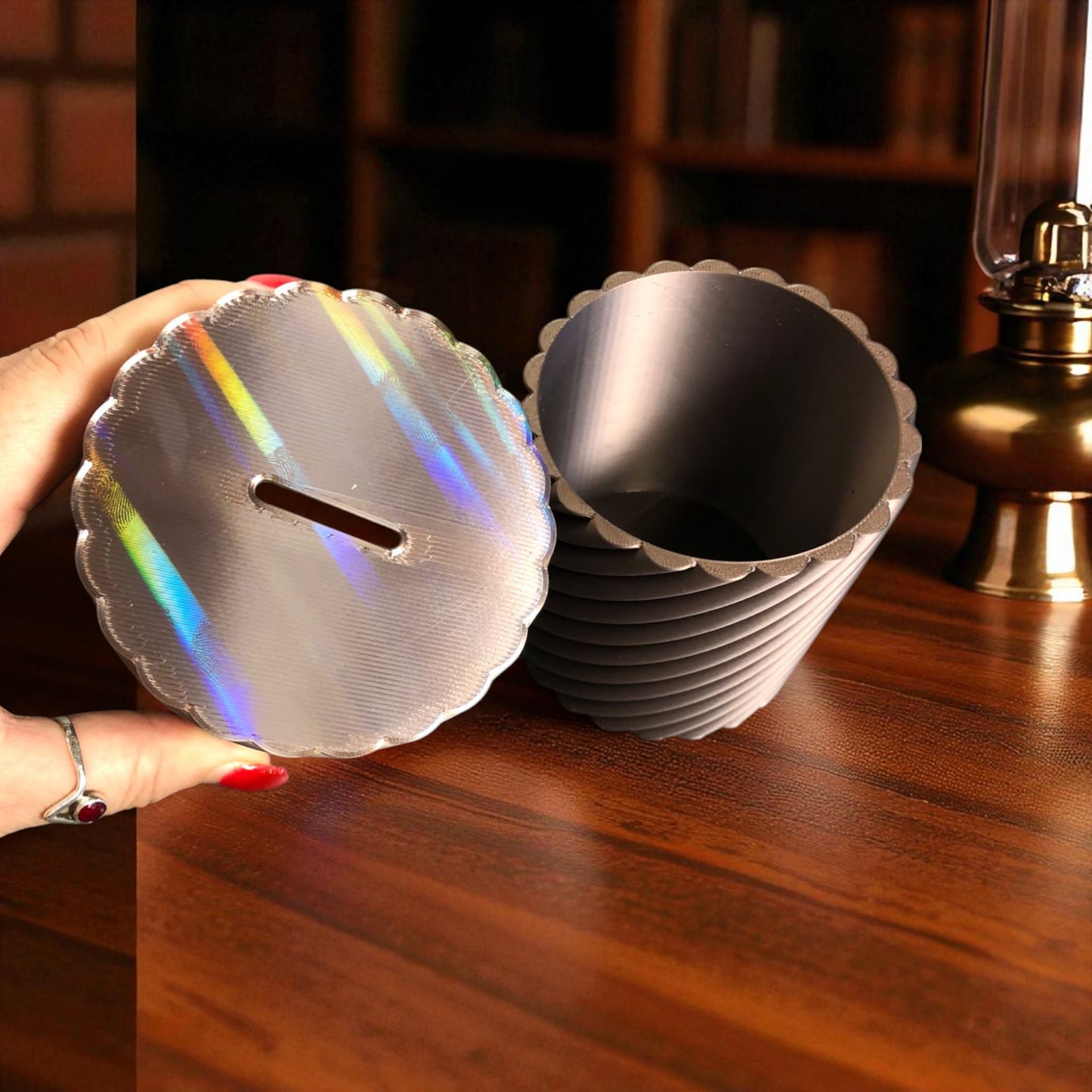a modern spiral coin bank with a unique closing mechanism. features a sleek, minimalist design where coins drop smoothly into the bank, and the lid twists shut in a mesmerizing spiral motion. perfect for stylish and satisfying money-saving!