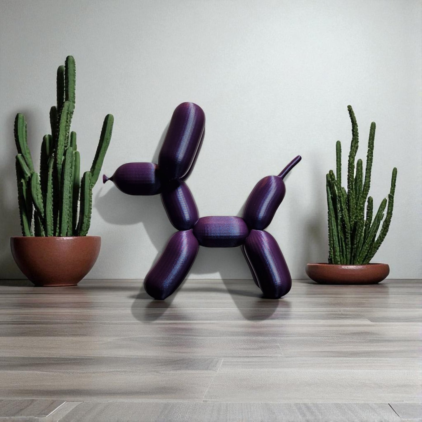 3d-printed figurine resembling a playful dog made from balloons, available in three different sizes. perfect for home decor, kids' rooms, or as a unique gift for dog lovers.