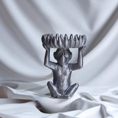 A charming monkey statue designed with a playful and detailed aesthetic, featuring a bowl atop its head shaped like a banana, perfect for holding fruit, candies, or small items, adding a whimsical touch to your home decor