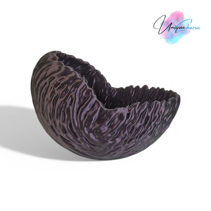 A beautifully designed walnut-shaped bowl resembling a quarter of a walnut shell, perfect as a key tray, candy dish, or nut bowl. Features a rustic, nature-inspired design with a smooth finish, making it a stylish and functional home décor piece.