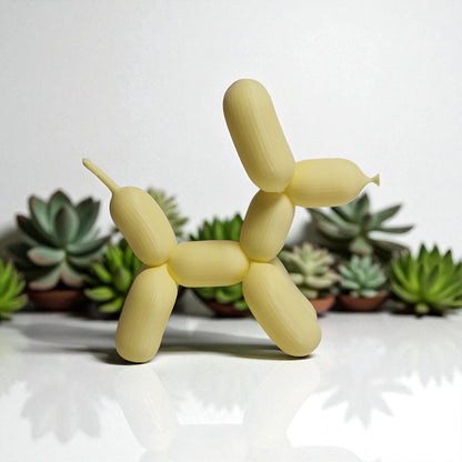 3D-printed figurine resembling a playful dog made from balloons, available in three different sizes. Perfect for home decor, kids' rooms, or as a unique gift for dog lovers.