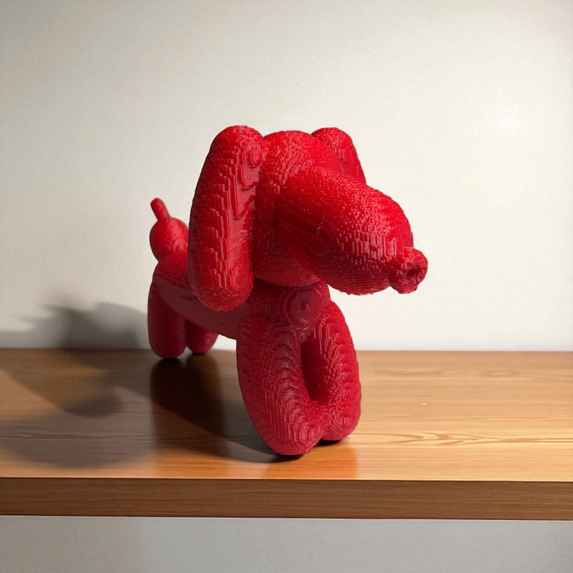 Pixel Dachshund Balloon Dog – A modern 3D-printed decorative piece inspired by a wiener dog, featuring a pixelated design for a unique and playful look. Available in two sizes, perfect for home or office decor.