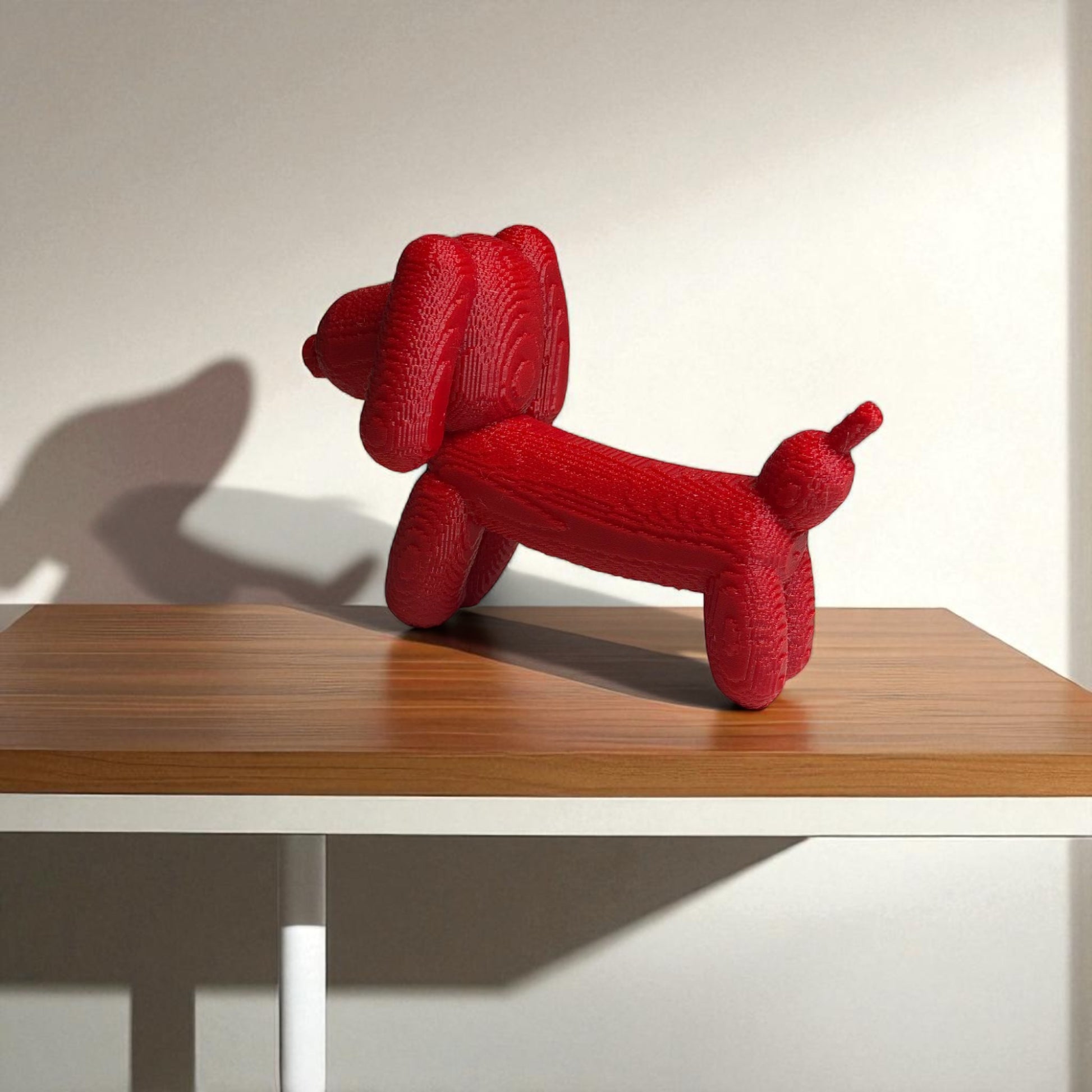 Pixel Dachshund Balloon Dog – A modern 3D-printed decorative piece inspired by a wiener dog, featuring a pixelated design for a unique and playful look. Available in two sizes, perfect for home or office decor.