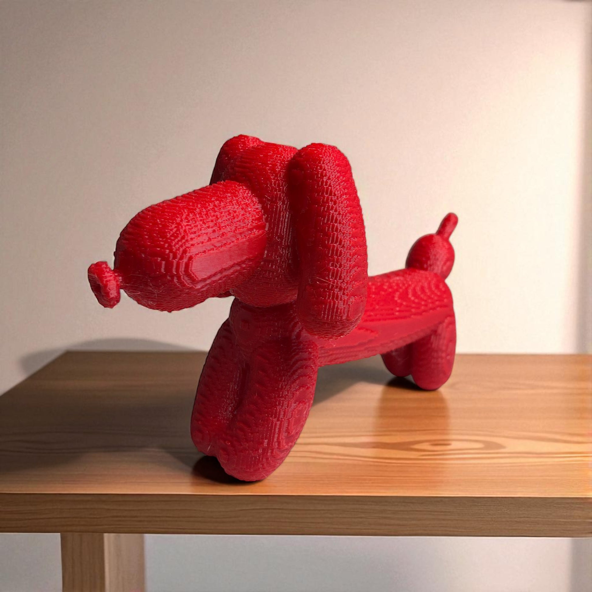Pixel Dachshund Balloon Dog – A modern 3D-printed decorative piece inspired by a wiener dog, featuring a pixelated design for a unique and playful look. Available in two sizes, perfect for home or office decor.