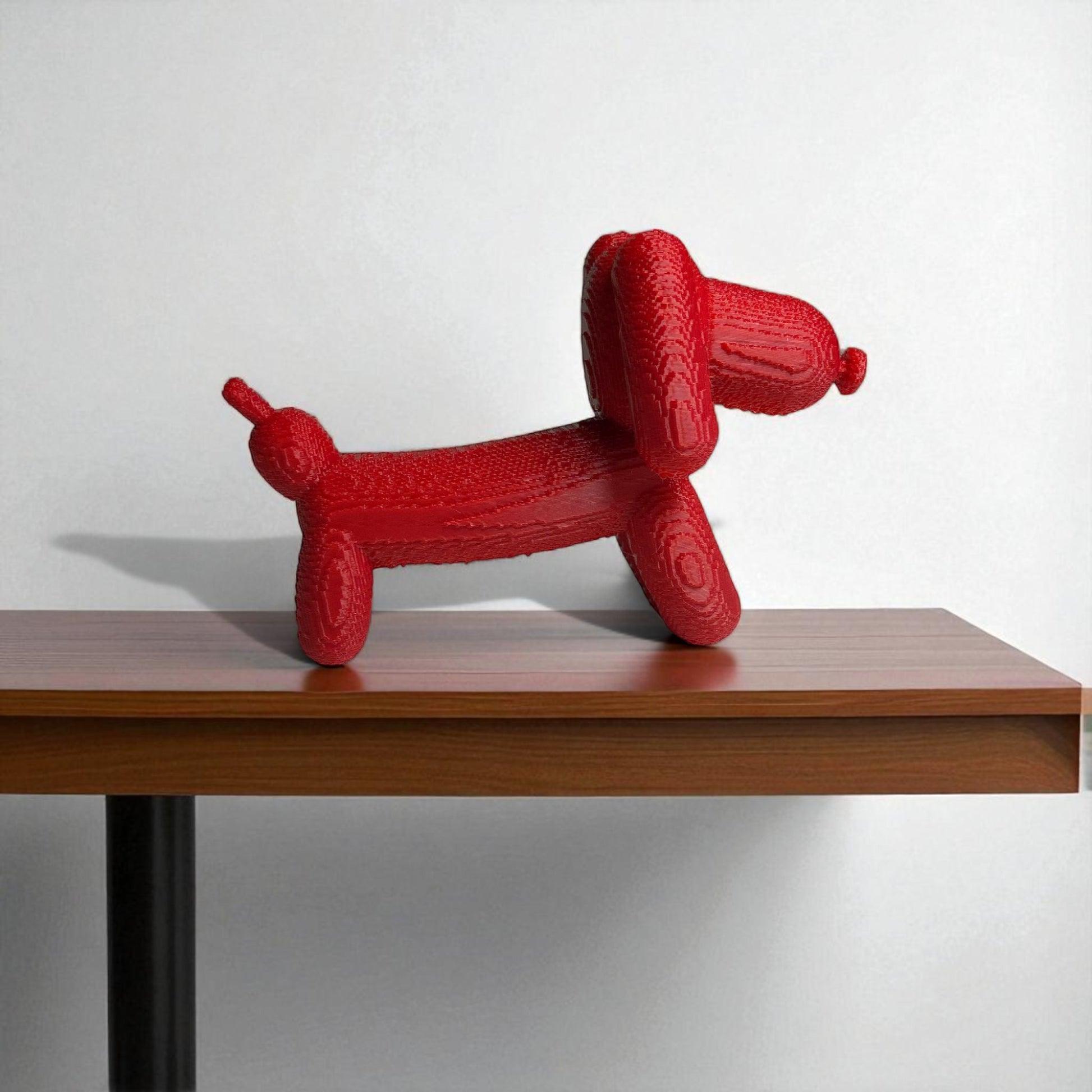 Pixel Dachshund Balloon Dog – A modern 3D-printed decorative piece inspired by a wiener dog, featuring a pixelated design for a unique and playful look. Available in two sizes, perfect for home or office decor.
