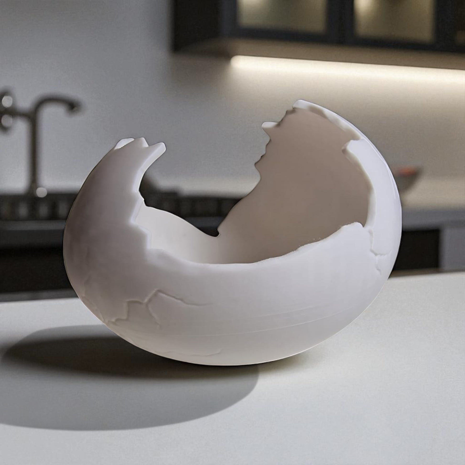 White ceramic egg-shaped object on a kitchen counter