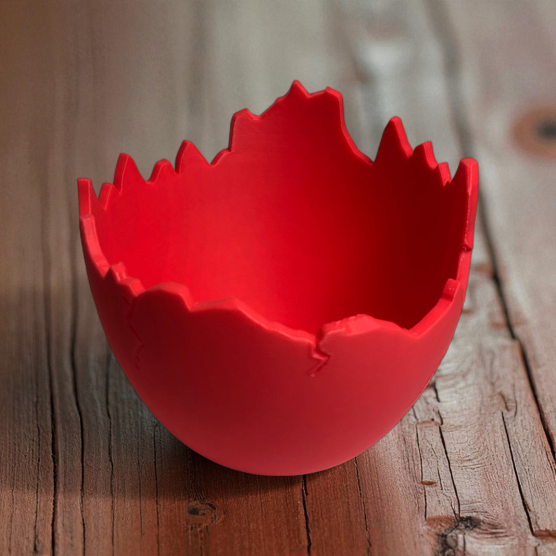 A modern cracked egg-shaped planter holding a small succulent, perfect for Easter decor and spring home styling. This unique plant pot is ideal for small to medium plants, adding a fresh and charming touch to any windowsill, desk, or shelf.