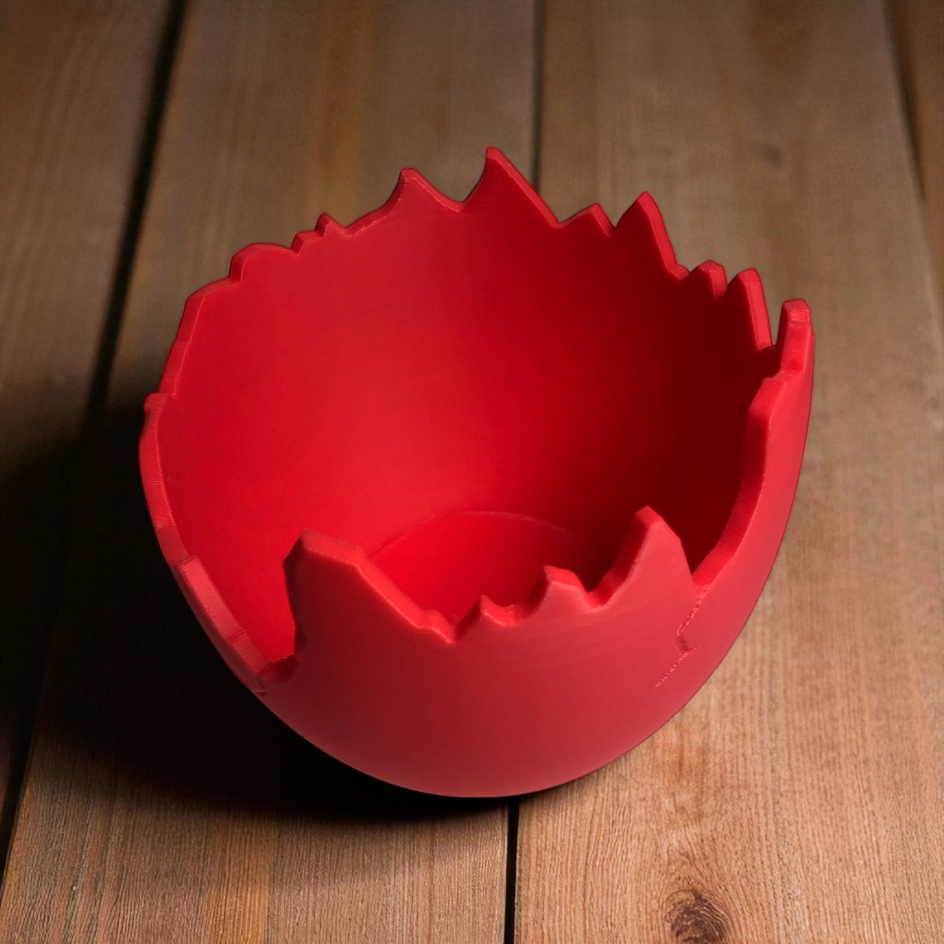A modern cracked egg-shaped planter holding a small succulent, perfect for Easter decor and spring home styling. This unique plant pot is ideal for small to medium plants, adding a fresh and charming touch to any windowsill, desk, or shelf.