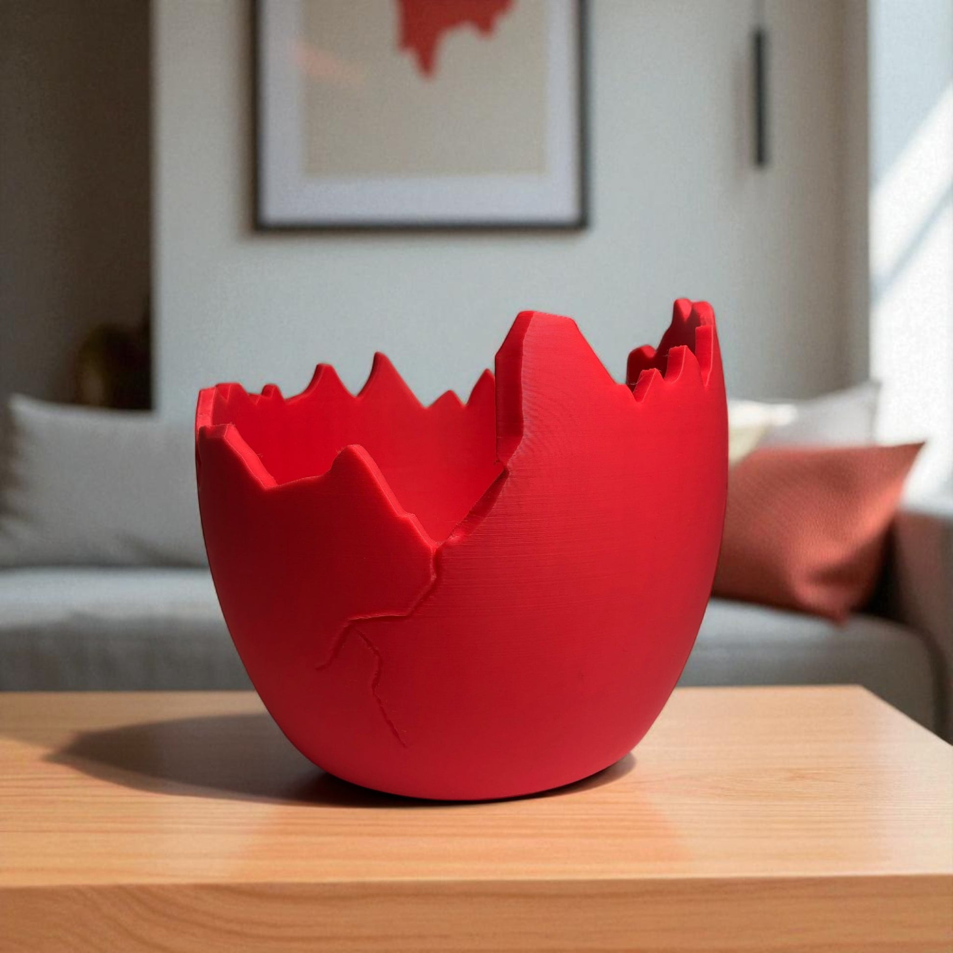 A modern cracked egg-shaped planter holding a small succulent, perfect for Easter decor and spring home styling. This unique plant pot is ideal for small to medium plants, adding a fresh and charming touch to any windowsill, desk, or shelf.
