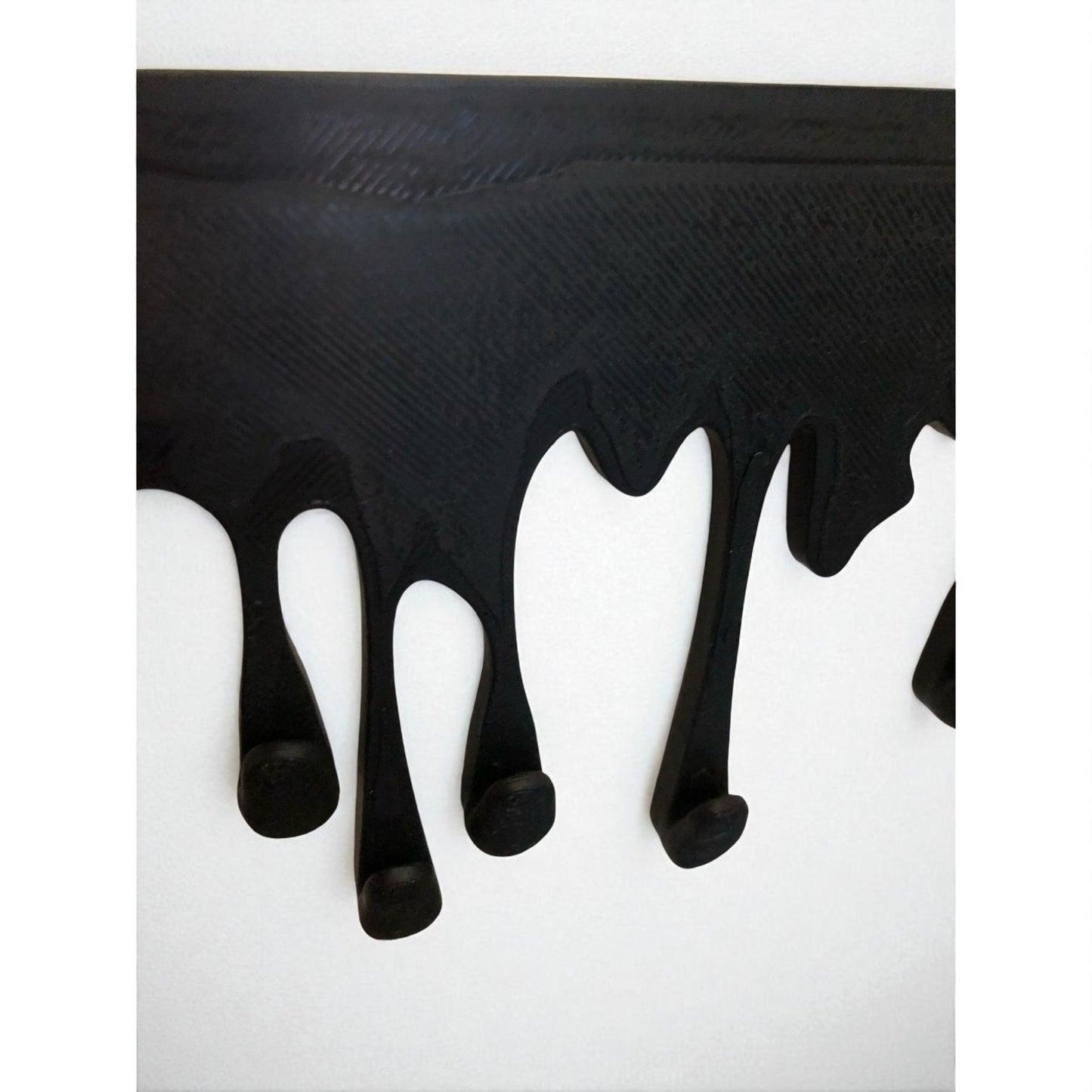 modern dripping key hanger with a unique dripping paint design, available in small (180mm x 90mm) and large (239mm x 120mm) sizes. holds up to 9 key sets and can be mounted with adhesive strips for a rent-friendly option or secured with screws for a permanent installation. a stylish and functional wall-mounted key organizer for homes, apartments, and offices.