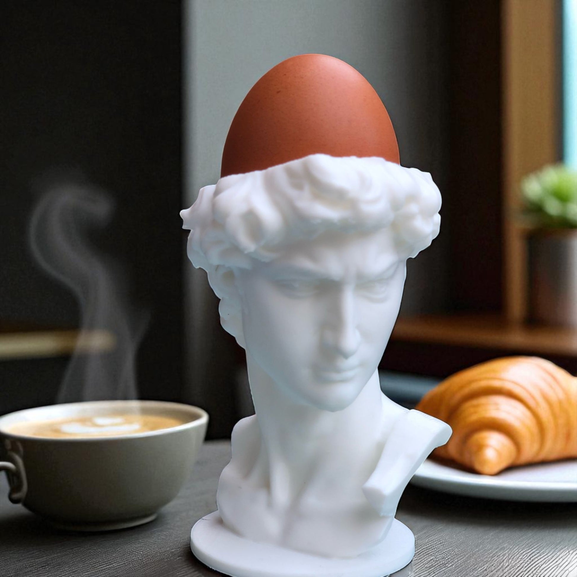 3D printed male bust egg cup in classical sculpture style, featuring a hollowed head holding a boiled egg. Unique breakfast decor piece in white PLA, perfect for Easter table settings or artistic kitchen gifts.