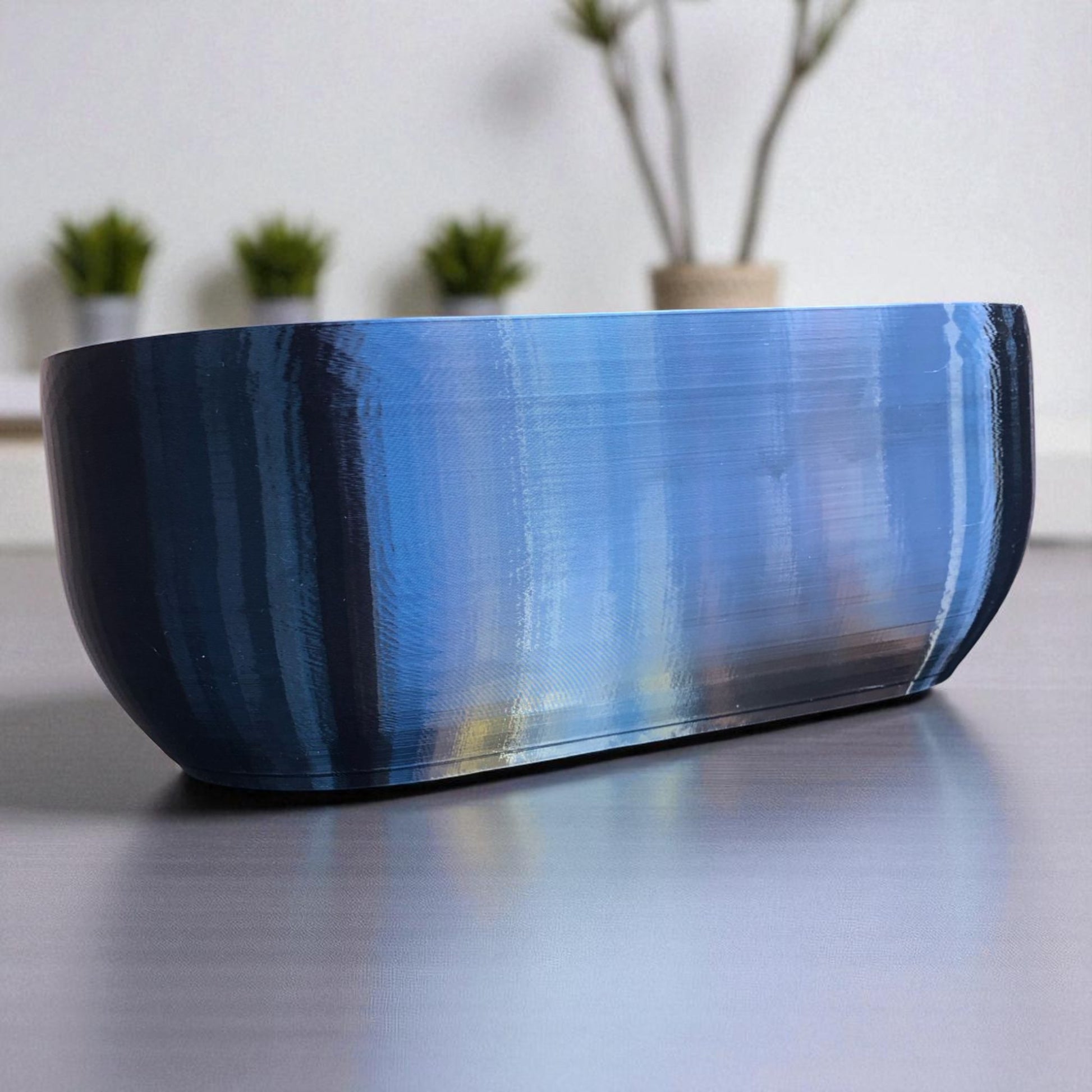 Modern rectangular wall planter with rounded corners, mounted on a wall and planted with fresh herbs like parsley, coriander, and basil. The large 3D printed planter is shown in use indoors, highlighting its sleek design and easy wall-mount installation with screws or tape
