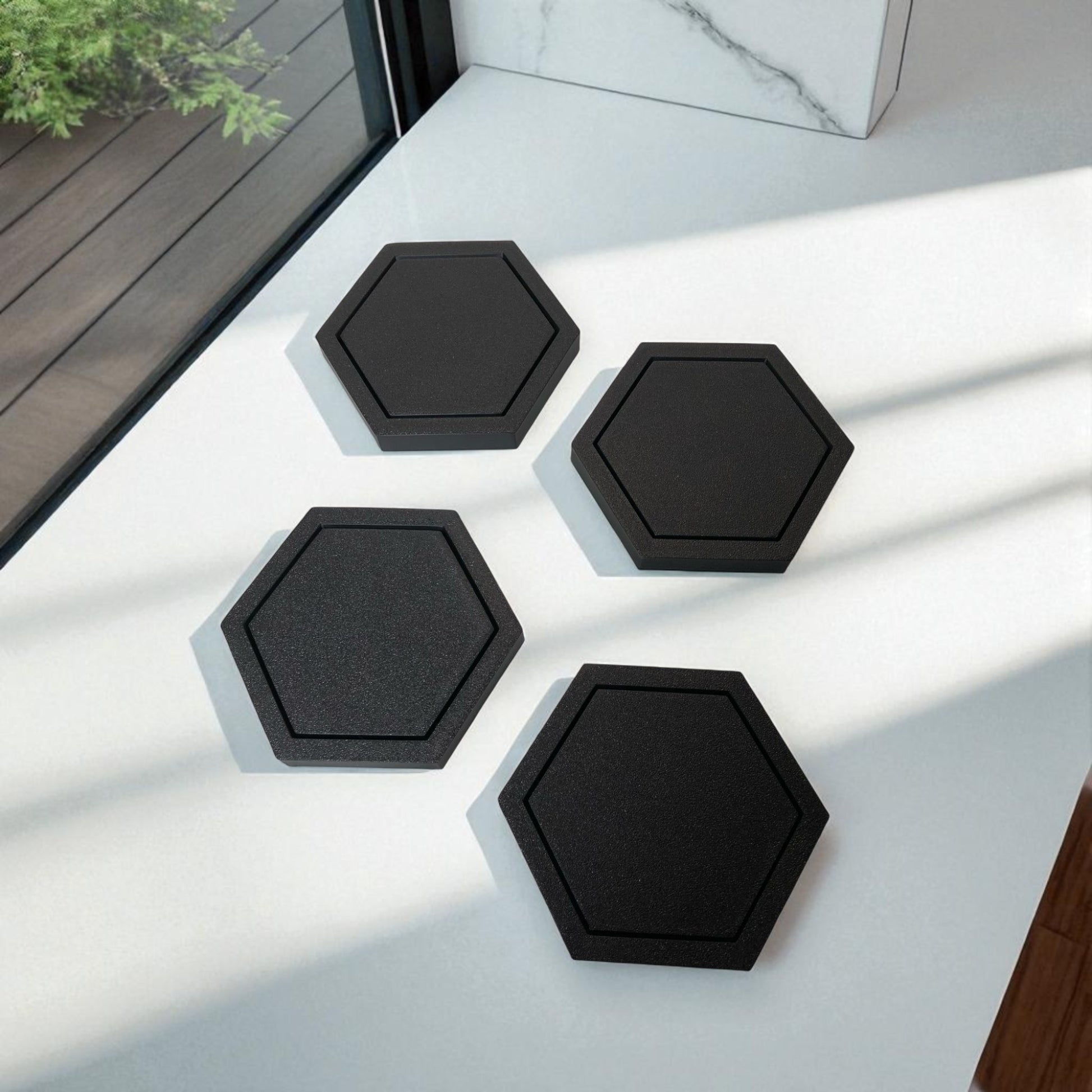 Modern hexagonal coaster in a minimalist design, measuring 115mm x 14mm, perfect for protecting surfaces from hot drinks. Available as a single piece, set of 4, or set of 6. Durable and stylish home decor accessory