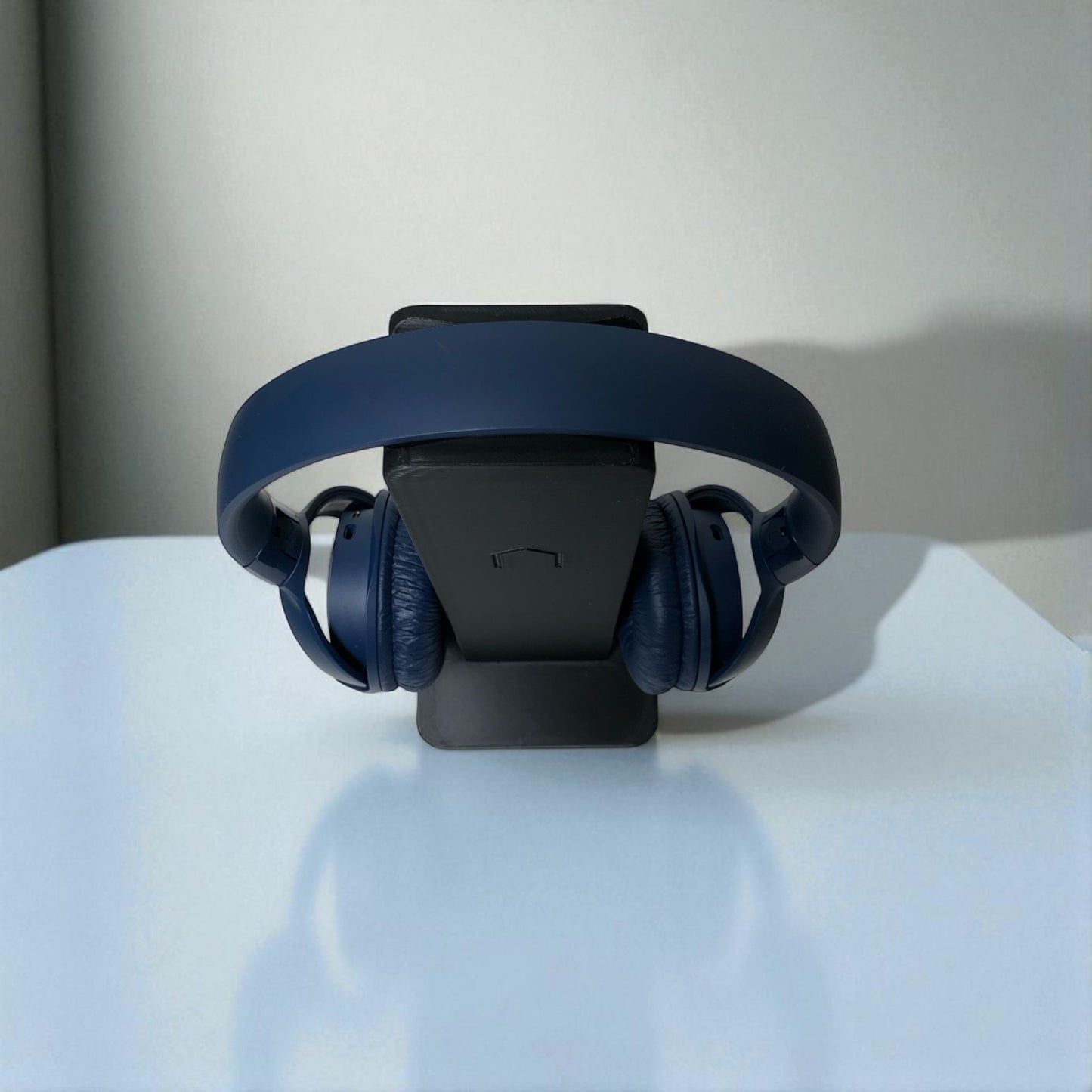 sleek rectangular headphone stand with a modern minimalist design, featuring a small notch for hanging headphones—ideal for desk organization, gaming setups, or home offices.