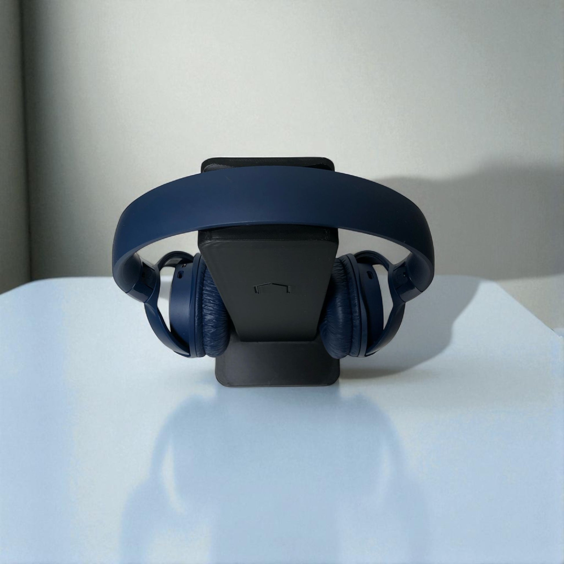 Sleek rectangular headphone stand with a modern minimalist design, featuring a small notch for hanging headphones—ideal for desk organization, gaming setups, or home offices.