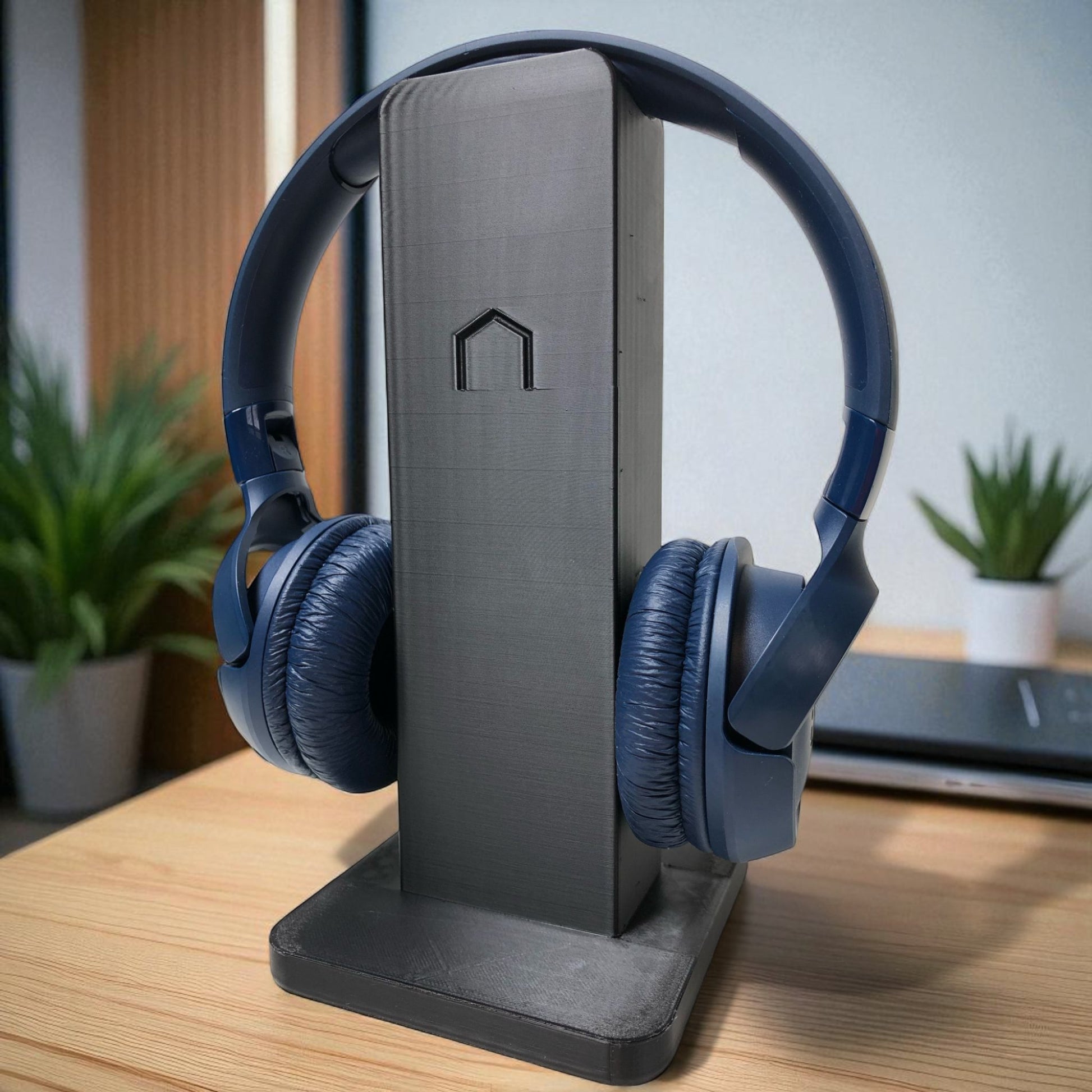 Sleek rectangular headphone stand with a modern minimalist design, featuring a small notch for hanging headphones—ideal for desk organization, gaming setups, or home offices.