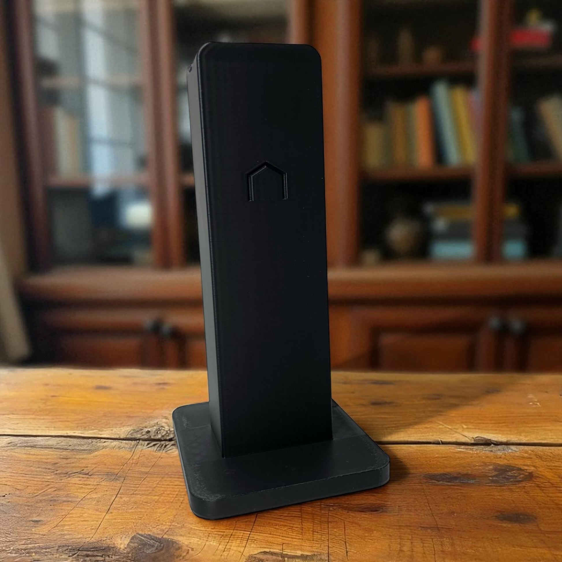Sleek rectangular headphone stand with a modern minimalist design, featuring a small notch for hanging headphones—ideal for desk organization, gaming setups, or home offices.