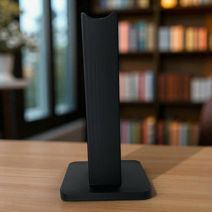 Sleek rectangular headphone stand with a modern minimalist design, featuring a small notch for hanging headphones—ideal for desk organization, gaming setups, or home offices.