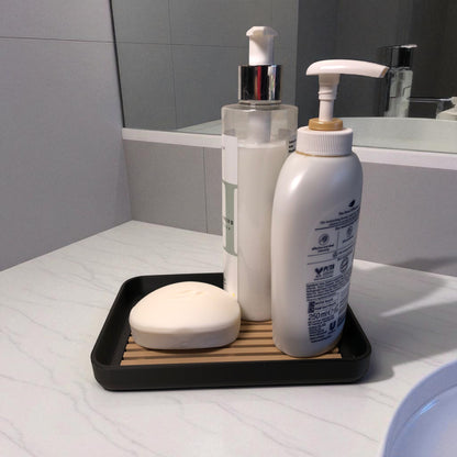 Modern soap tray with raised drainage support, shown holding a soap bar and pump bottle, perfect for bathroom organization and keeping soap dry

