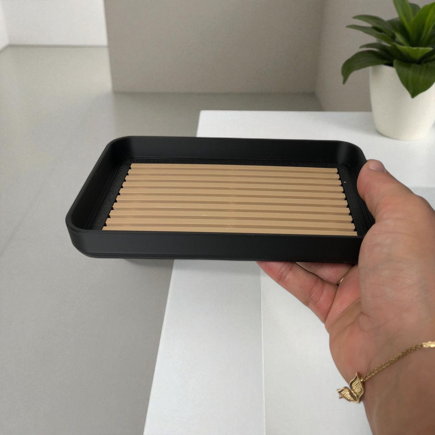 modern soap tray with raised drainage support, shown holding a soap bar and pump bottle, perfect for bathroom organization and keeping soap dry

