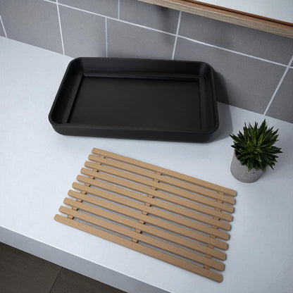 Modern soap tray with raised drainage support, shown holding a soap bar and pump bottle, perfect for bathroom organization and keeping soap dry

