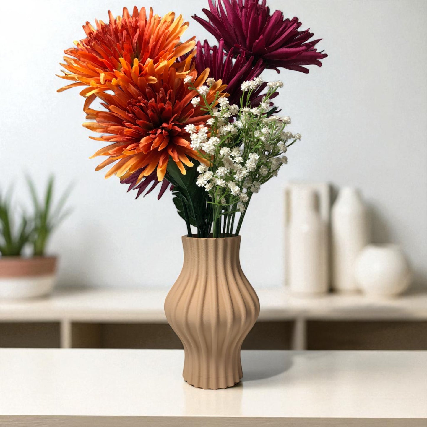 modern 3d printed sculptural vase with wavy vertical grooves, shown in matte beige color on a white background – minimalist nordic home decor centerpiece.