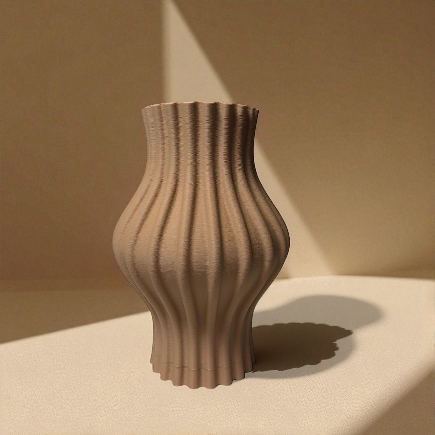 modern 3d printed sculptural vase with wavy vertical grooves, shown in matte beige color on a white background – minimalist nordic home decor centerpiece.