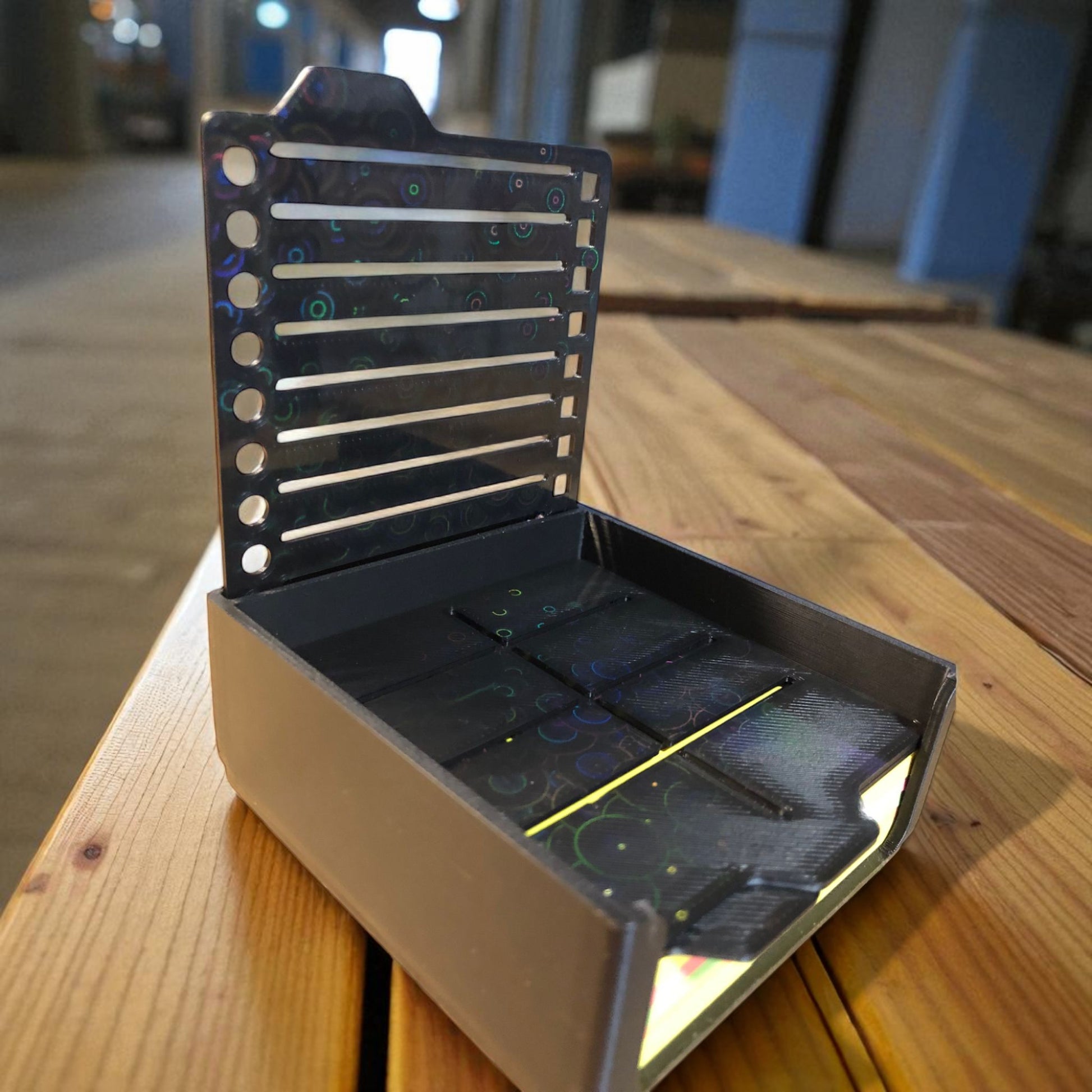 Sticky note holder with colorful sticky notes and three reusable stencils, designed for organizing notes and boosting productivity at a work desk