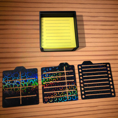 Sticky note holder with colorful sticky notes and three reusable stencils, designed for organizing notes and boosting productivity at a work desk