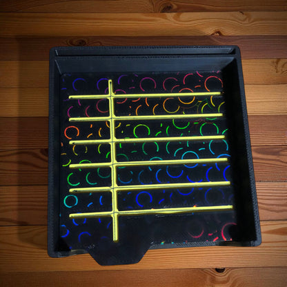 Sticky note holder with colorful sticky notes and three reusable stencils, designed for organizing notes and boosting productivity at a work desk