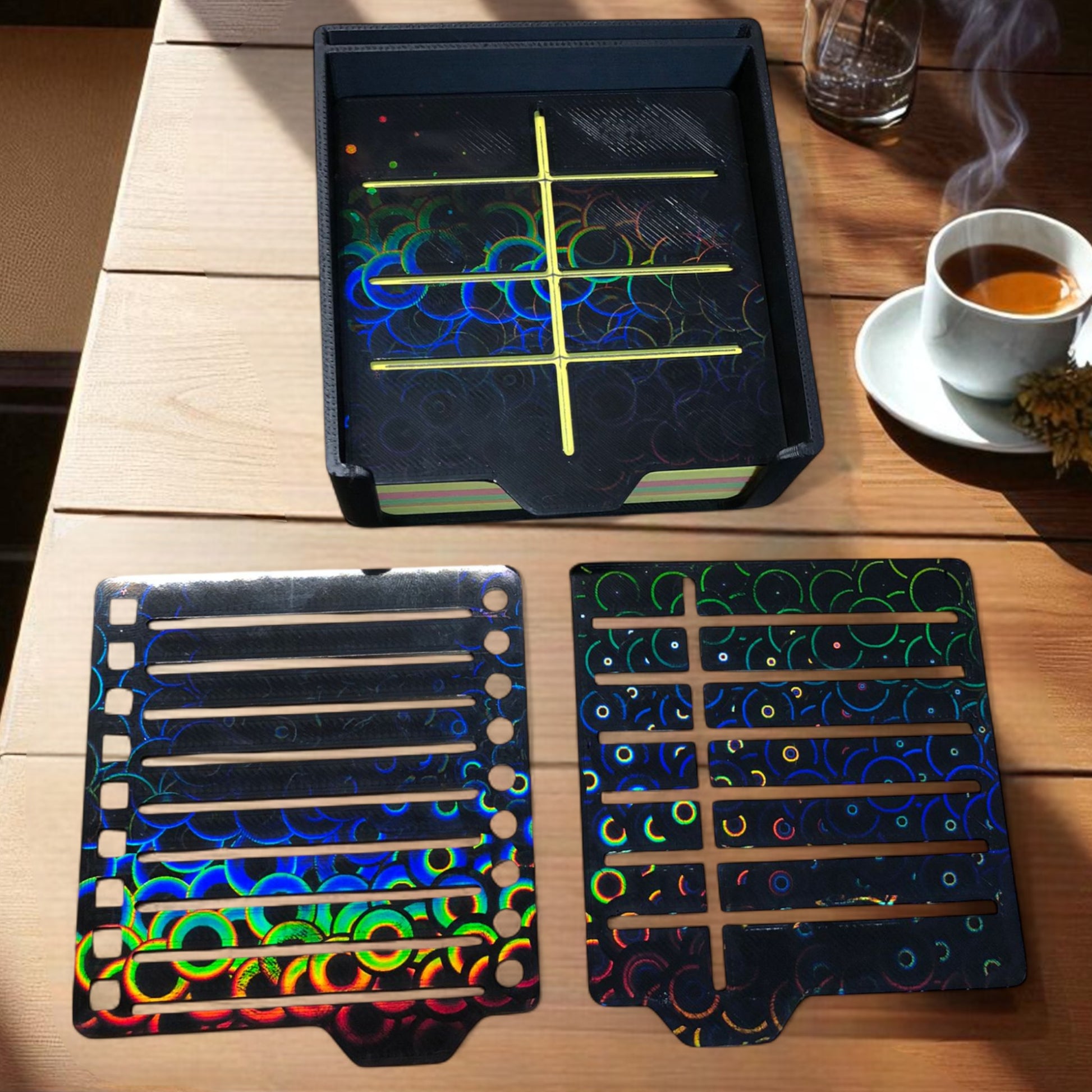 Sticky note holder with colorful sticky notes and three reusable stencils, designed for organizing notes and boosting productivity at a work desk