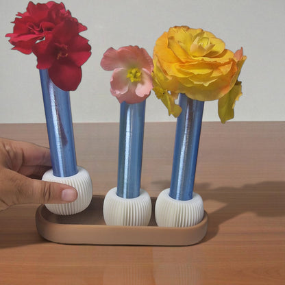  modern 3-vase set, designed for anyone who loves fresh flowers and clean design. This eye-catching piece includes three sleek test tube-style vases securely held in a beautifully minimal tray – perfect for desks, coffee tables, windowsills, or shelves.