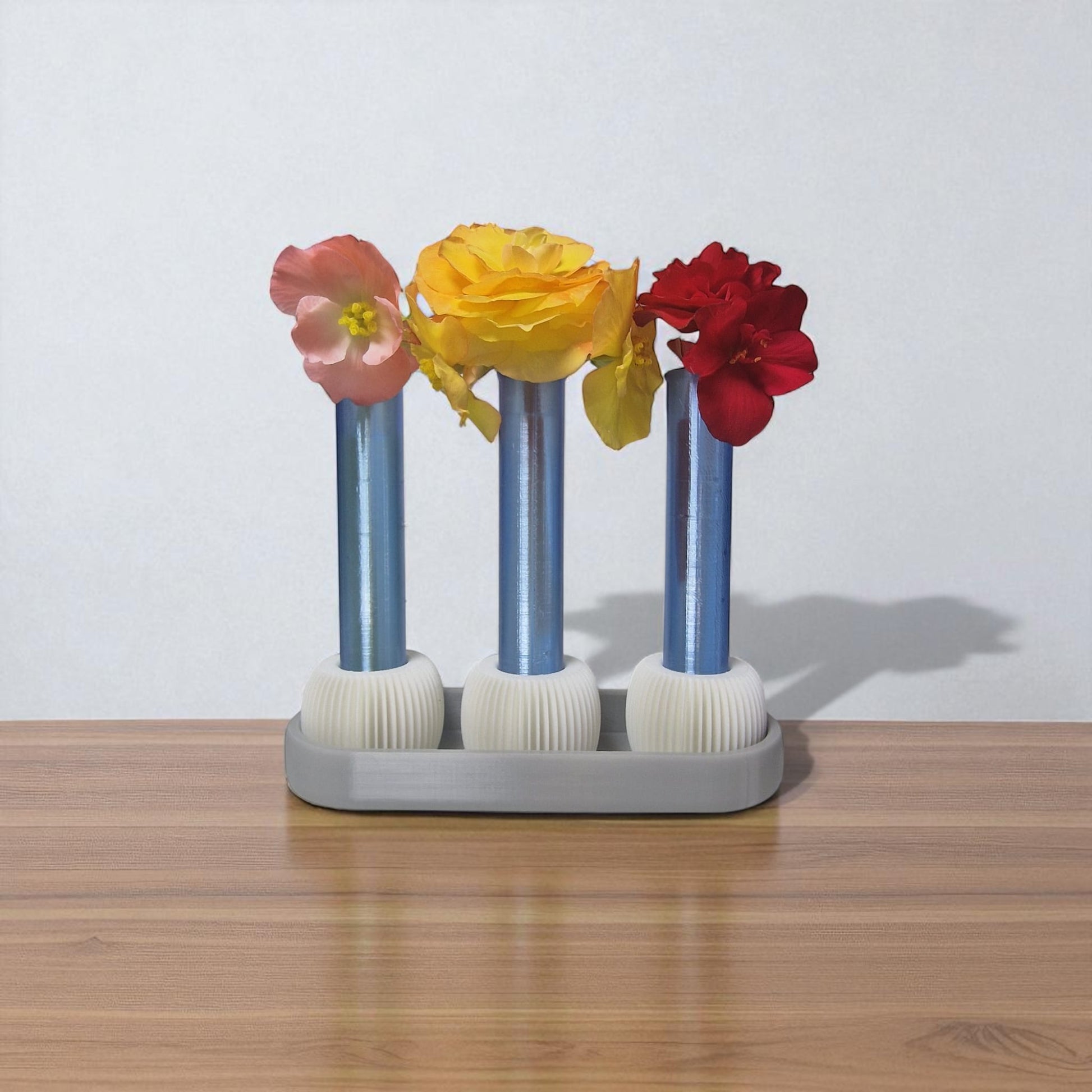  modern 3-vase set, designed for anyone who loves fresh flowers and clean design. This eye-catching piece includes three sleek test tube-style vases securely held in a beautifully minimal tray – perfect for desks, coffee tables, windowsills, or shelves.