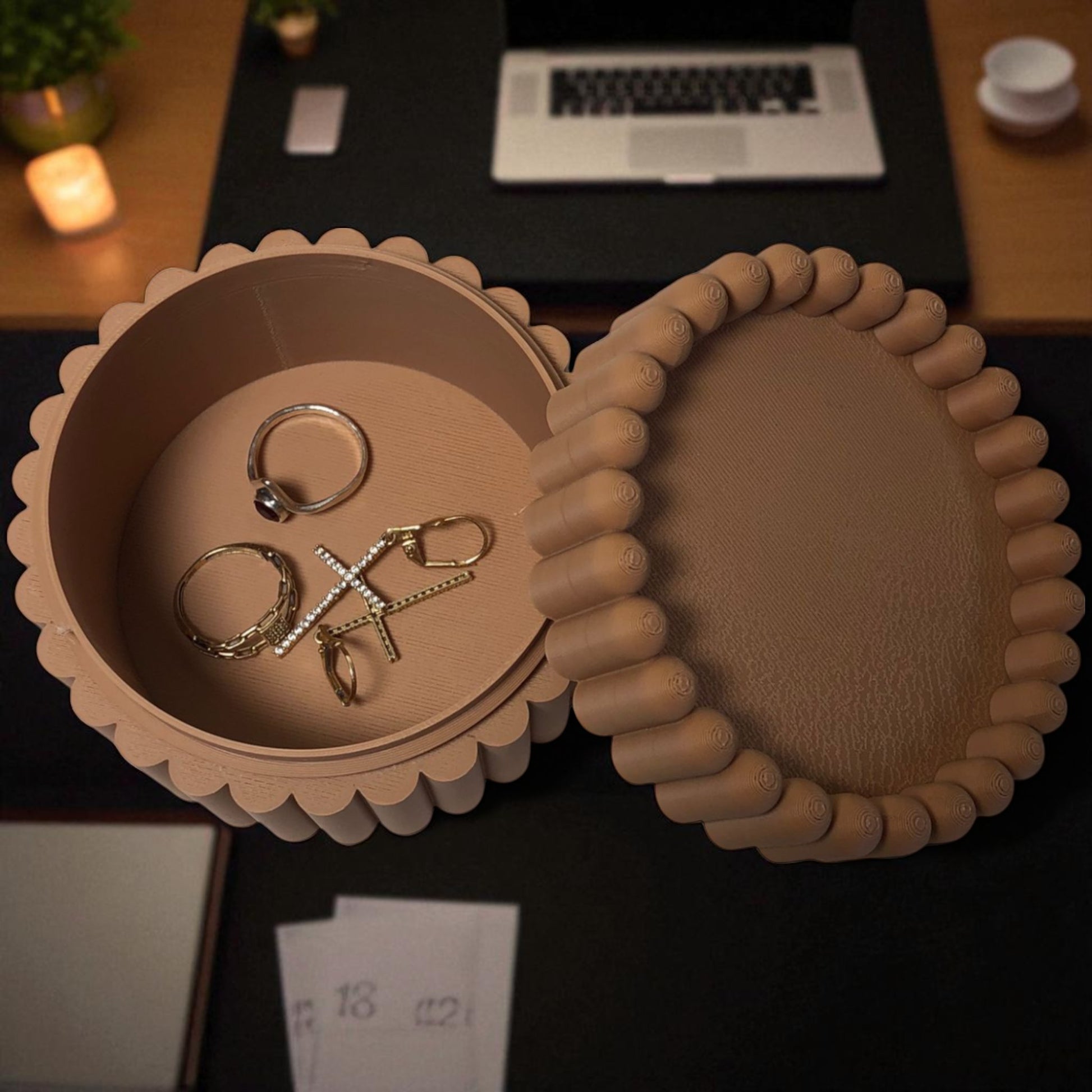 3D printed macaron-style jar with a rounded lid and ribbed cookie-like sides, shown in brown and pink colors, used for vanity or bathroom storage.