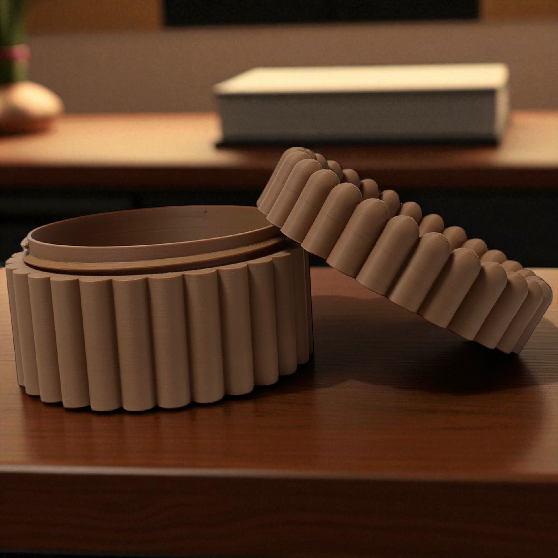 3D printed macaron-style jar with a rounded lid and ribbed cookie-like sides, shown in brown and pink colors, used for vanity or bathroom storage.