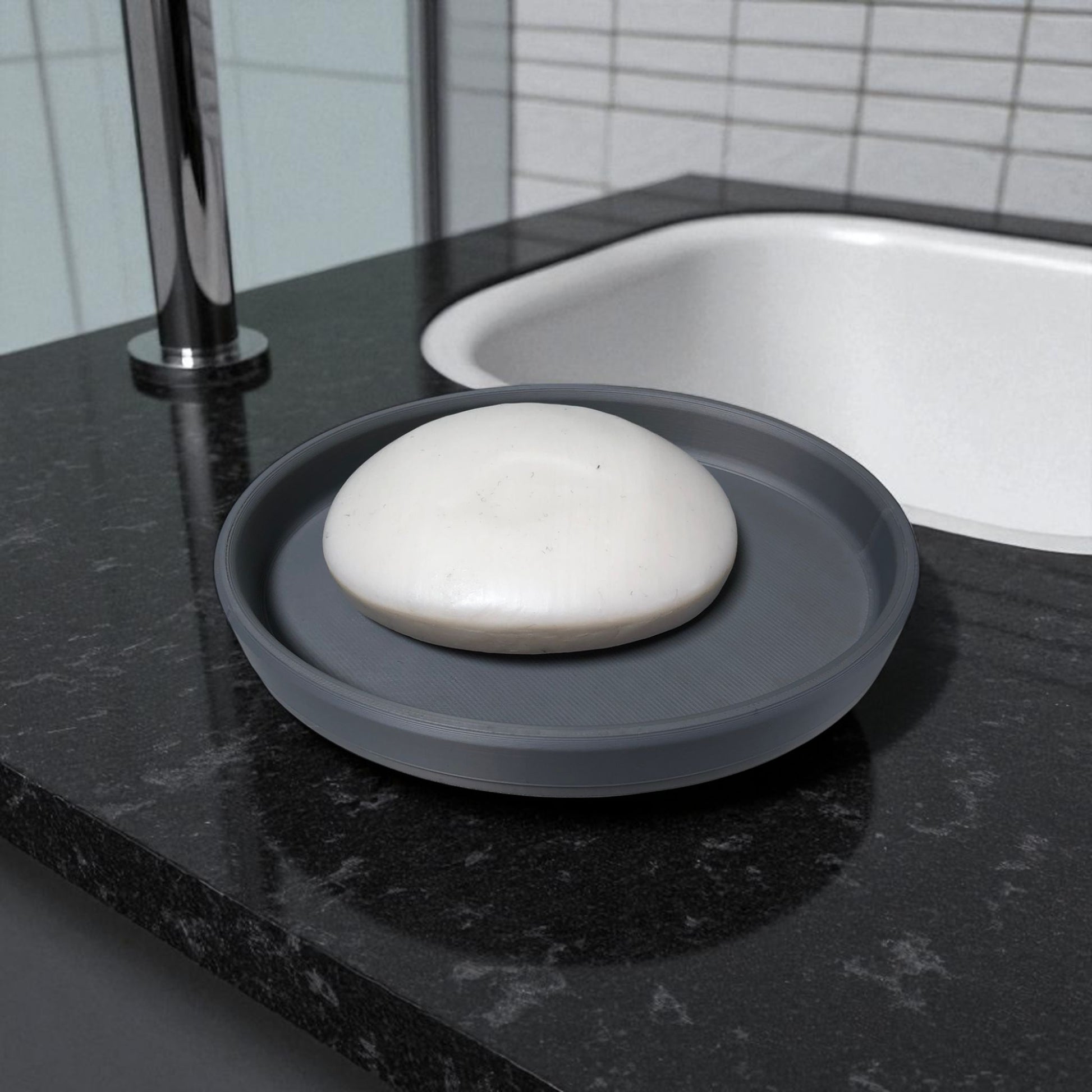 Modern minimalist toothbrush cup and soap dish set, 3D printed and available in multiple colours including grey, white, charcoal, and beige. Toothbrush holder shown with toothpaste and toothbrush inside, and soap tray holding a white bar of soap. Designed for stylish and organized bathroom use.