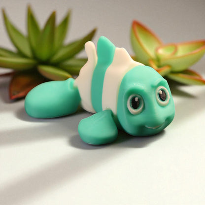 3D printed articulated clown fish toy in vibrant two-tone colors, featuring a cute face and flexible, lifelike movement, perfect as a keychain or playful ocean-themed gift.