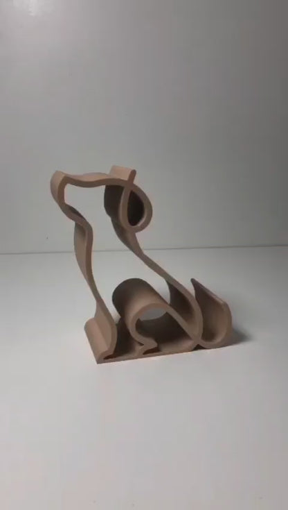 3D printed pink dog-shaped phone holder for desk, used to support a smartphone, tablet, or Kindle, ideal for pet lovers and home office decor